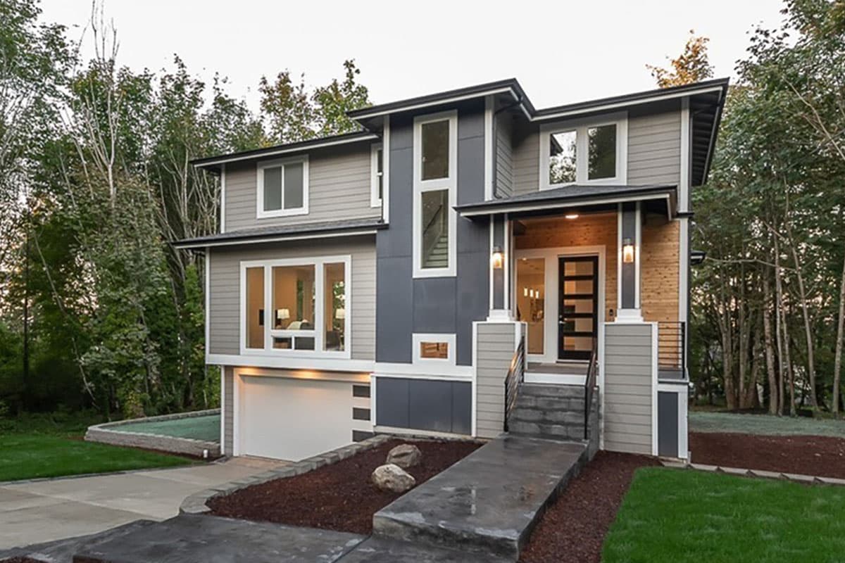 Modern two-story house plan exterior with a flat roof, large windows, covered entry, and attached garage.