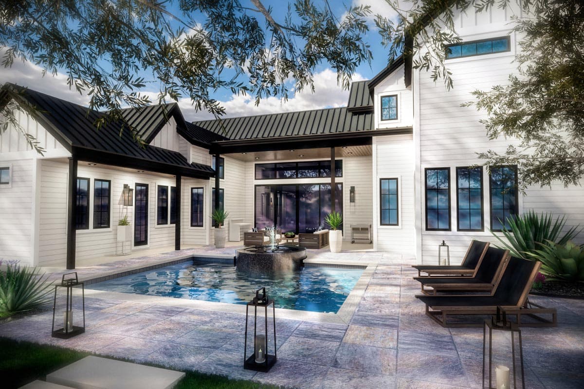 Modern farmhouse house plan exterior with white siding, black metal roof, multiple gables, and pool.