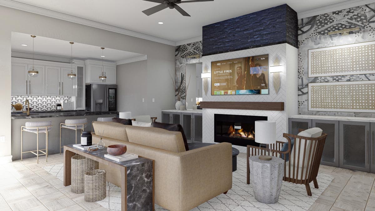 Open-concept living area with kitchen, fireplace, media wall, and seating. Features island bar, stone fireplace, and decorative wall panels.