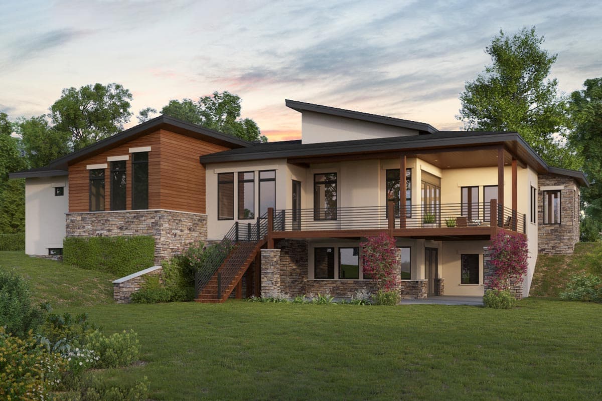 House plan exterior: Modern design with layered rooflines, stone and wood facade, and a wraparound deck.