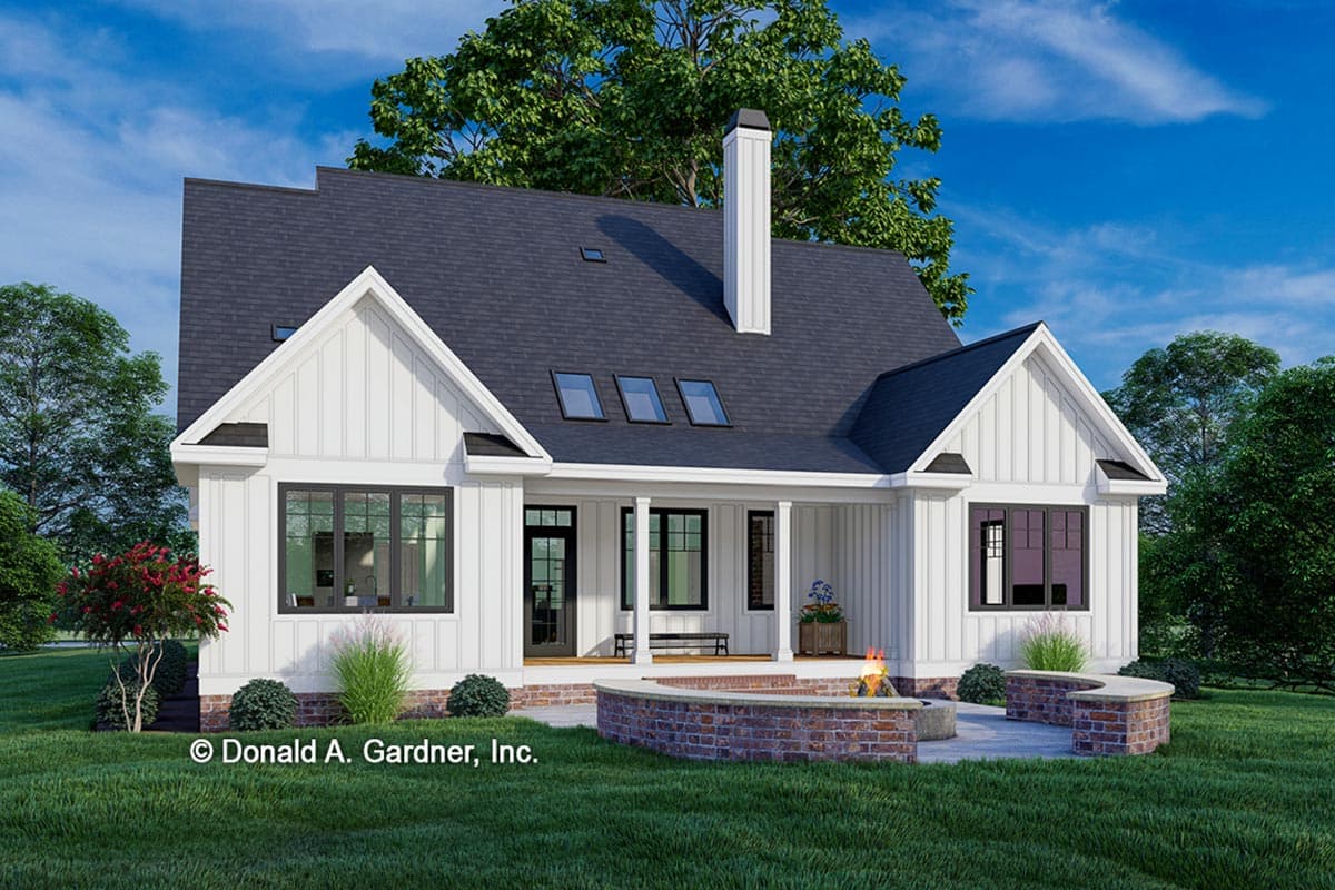 Modern Farmhouse house plan exterior with gables, shed dormers, a covered porch, and a prominent chimney.