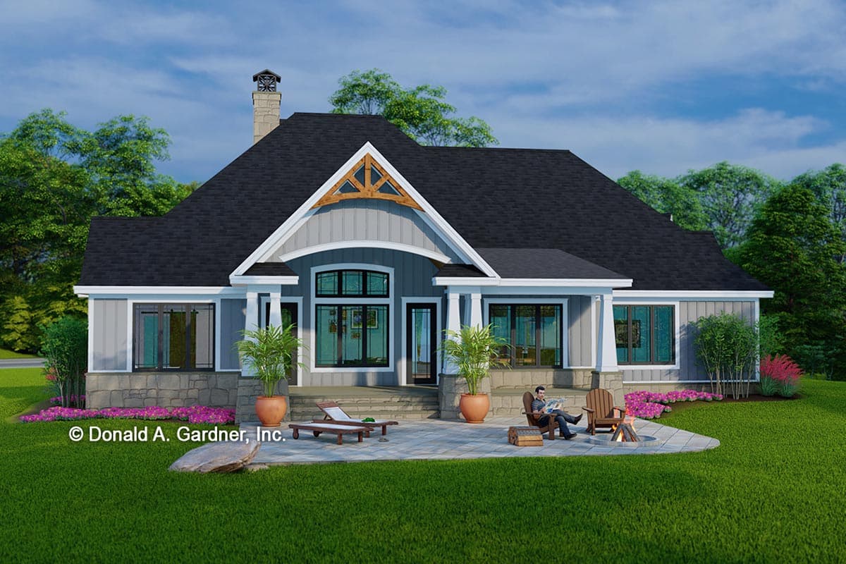 House plan exterior: Ranch style, single story with stone and siding, prominent gables, and covered porches.