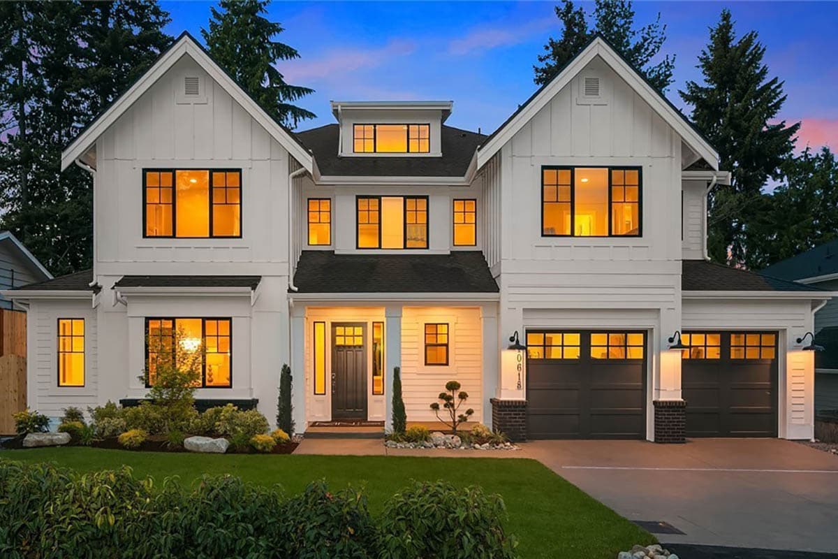 House plan exterior featuring a two-story Modern Farmhouse design. Includes a covered entry porch, multiple gables, and an attached two-car garage.