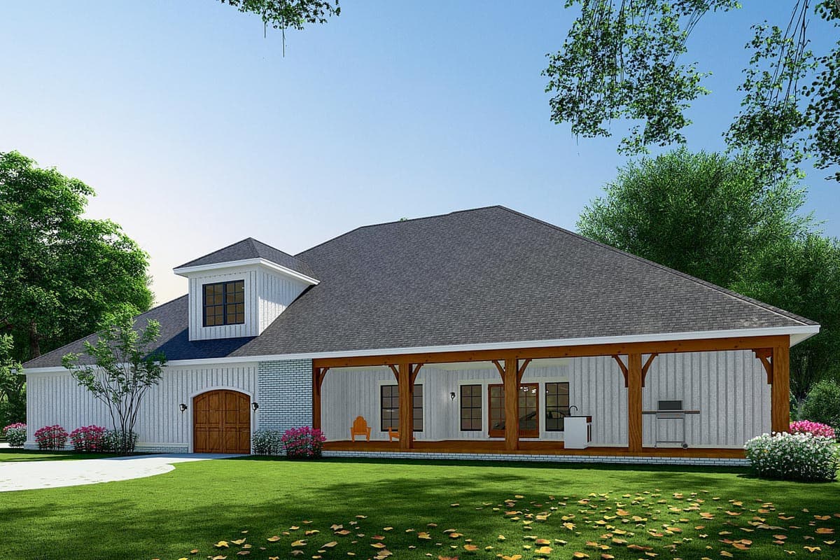 House plan exterior: Ranch style with a dormer, porte-cochère, and covered porch with exposed beams.
