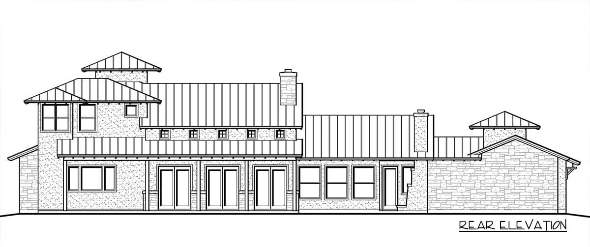 Rear elevation of a multi-story house plan featuring stone and stucco siding, multiple gables, and metal roofs.