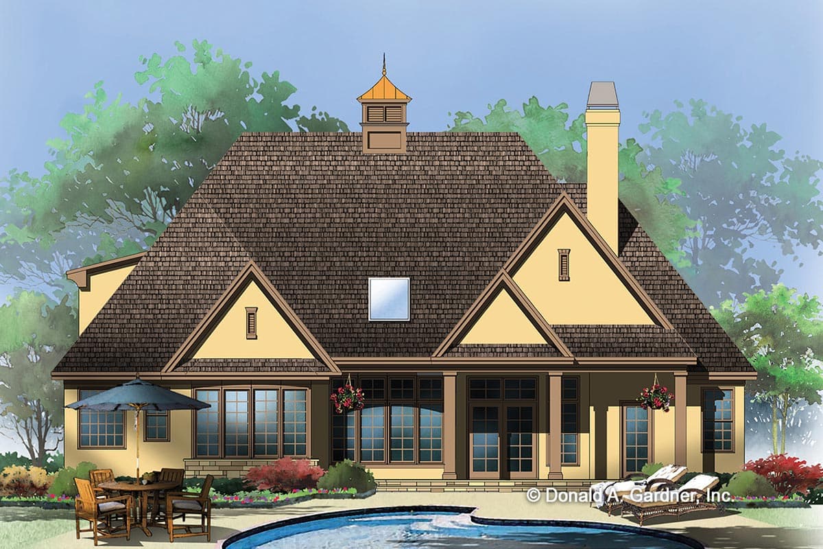 House plan exterior with steep gables, multiple rooflines, a cupola, and a covered porch.