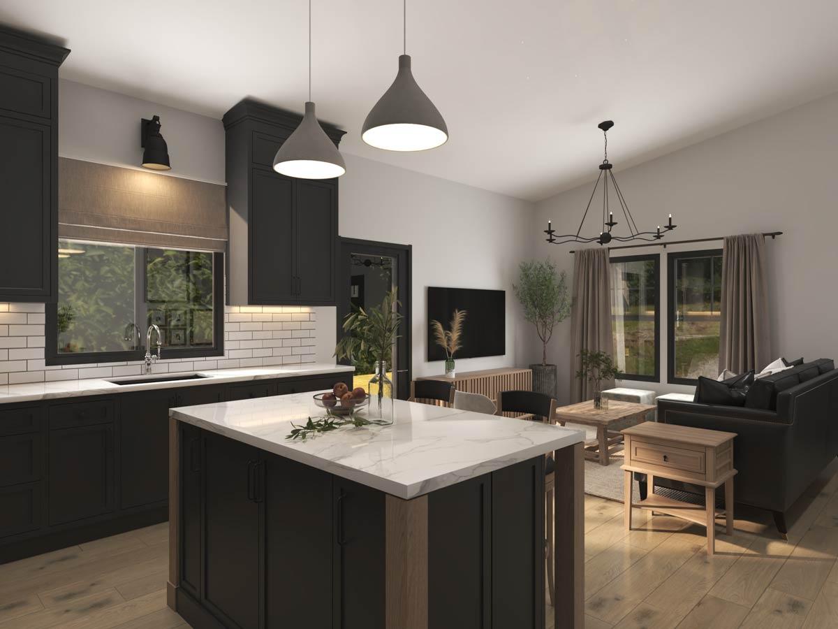 Kitchen with island, subway tile backsplash, and adjacent living room with vaulted ceiling and large windows.