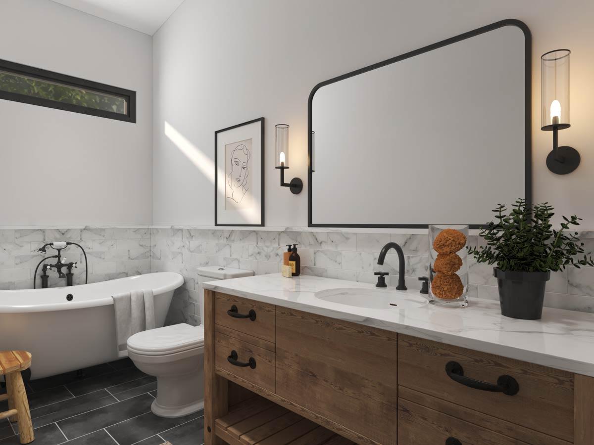Modern bathroom with freestanding tub, wood vanity with double sinks, large mirror, and marble tile accent wall.