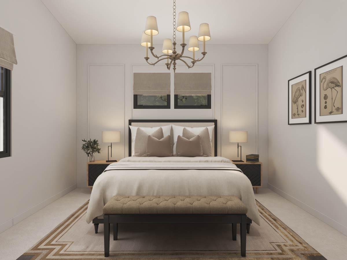 Primary bedroom with king bed, flanked by nightstands with lamps, bench at foot of bed, and decorative wall art.