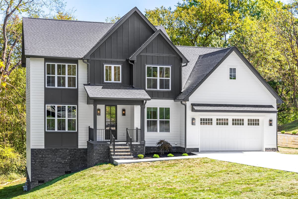 Modern Farmhouse house plan exterior with a prominent gable, covered entry porch, and attached two-car garage.