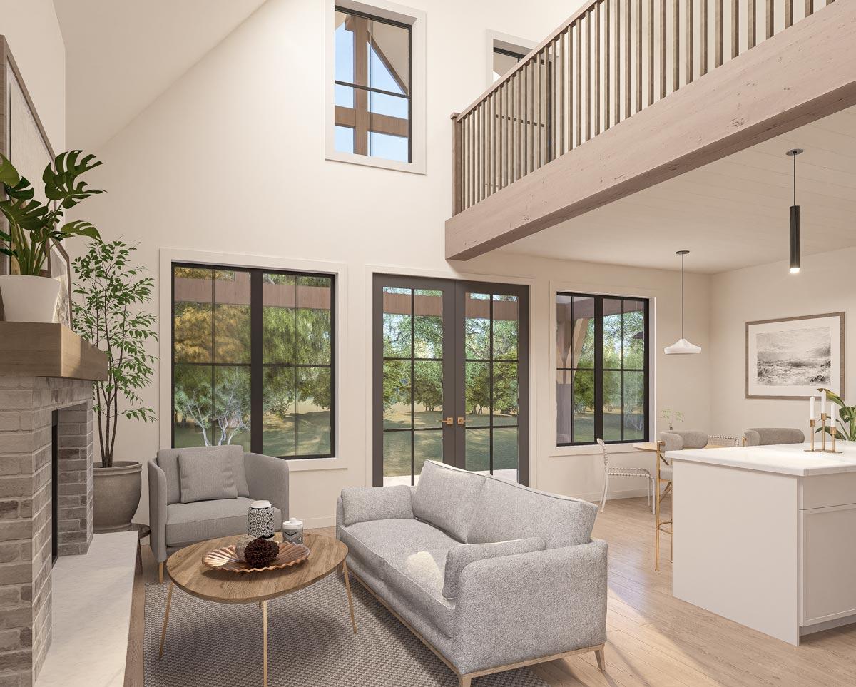 Interior view of open-concept living space with fireplace, vaulted ceiling, lofted balcony, and large windows.