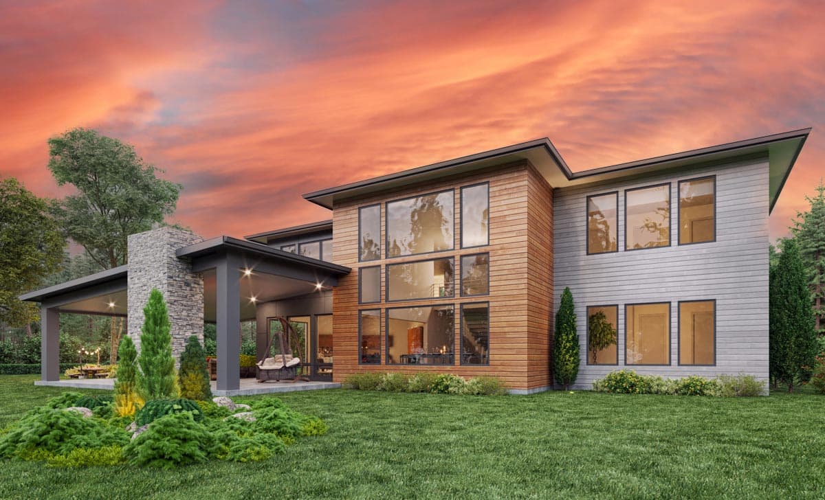 Modern house plan exterior featuring a stone chimney, covered patio, and large wood-clad window wall.