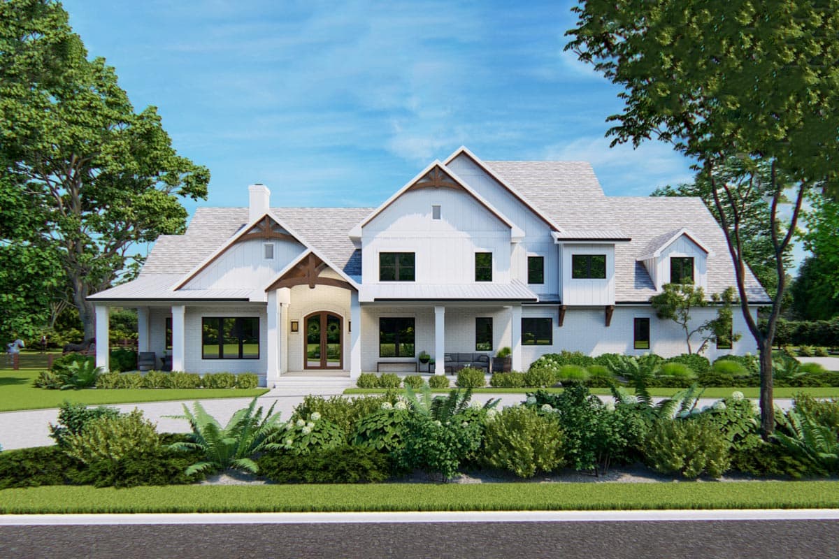 Modern Farmhouse house plan exterior with a wrap-around porch, multiple gables, and a brick facade.
