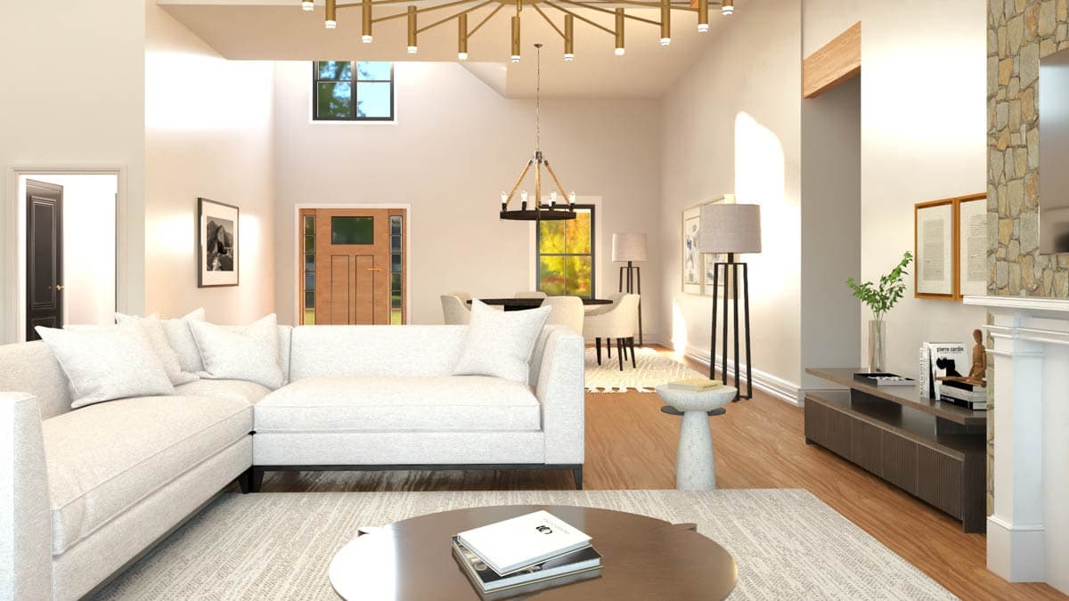 Interior rendering showing a great room with a sectional sofa, fireplace, dining area, and vaulted ceiling with modern chandeliers.