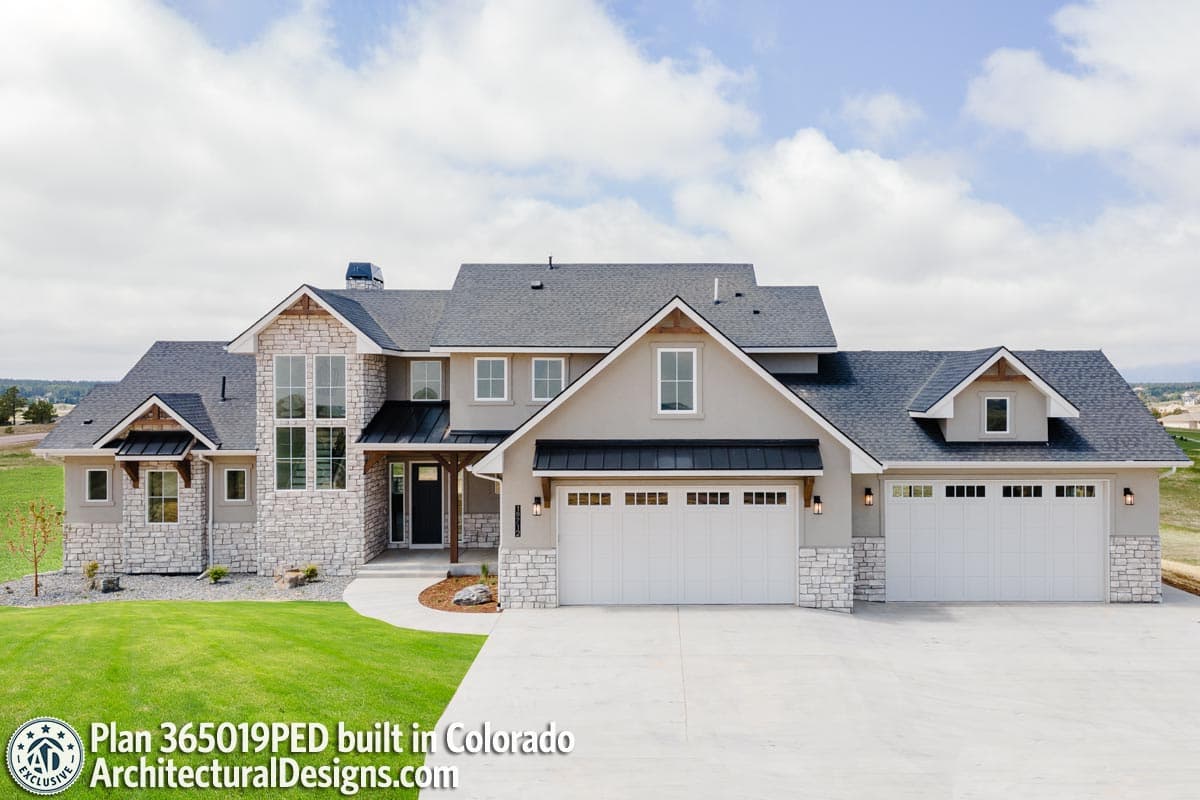 House plan exterior of a two-story Modern Farmhouse with a three-car garage, stone accents, and prominent gables.