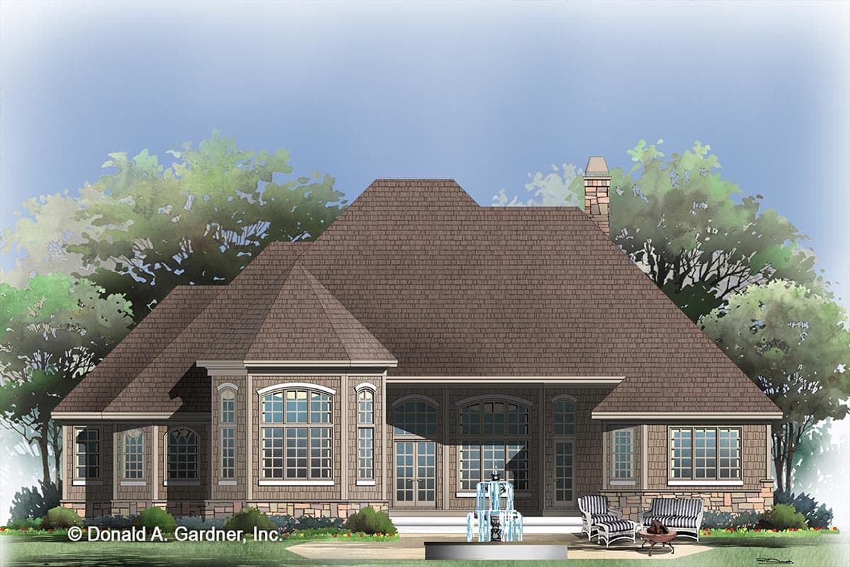 House plan exterior showing a multi-level roof, stone and shingle siding, and arched windows.