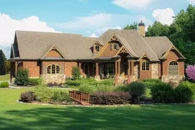 Rustic Craftsman with an Angled 2-car Garage and a 2-Story Lodge Room Open to the Kitchen