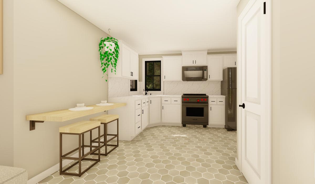 Kitchen with white cabinetry, island counter with stools, and hexagonal floor tiles.