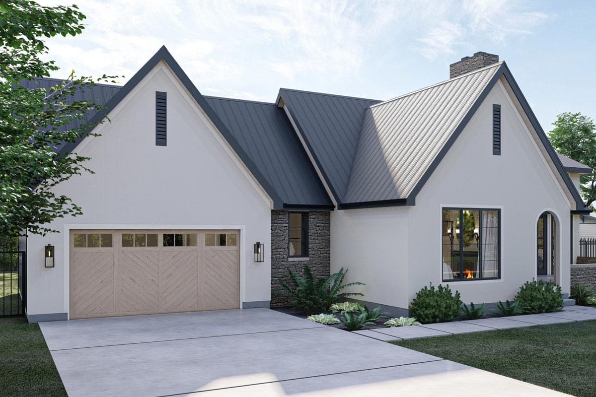 Modern Farmhouse style house plan exterior with a metal roof, gabled dormers, stone accents, and a wide garage door.