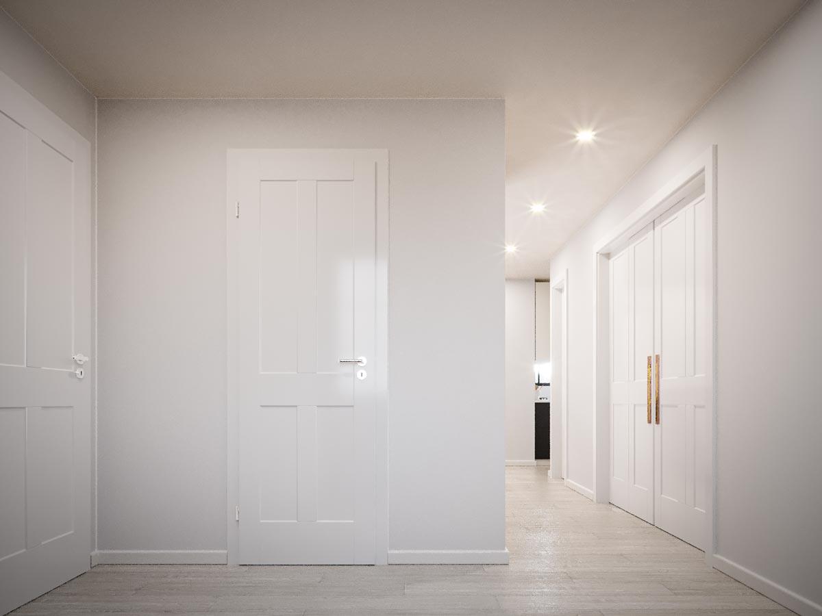 Interior hallway with multiple paneled doors and recessed ceiling lights. View extends to a kitchen area.
