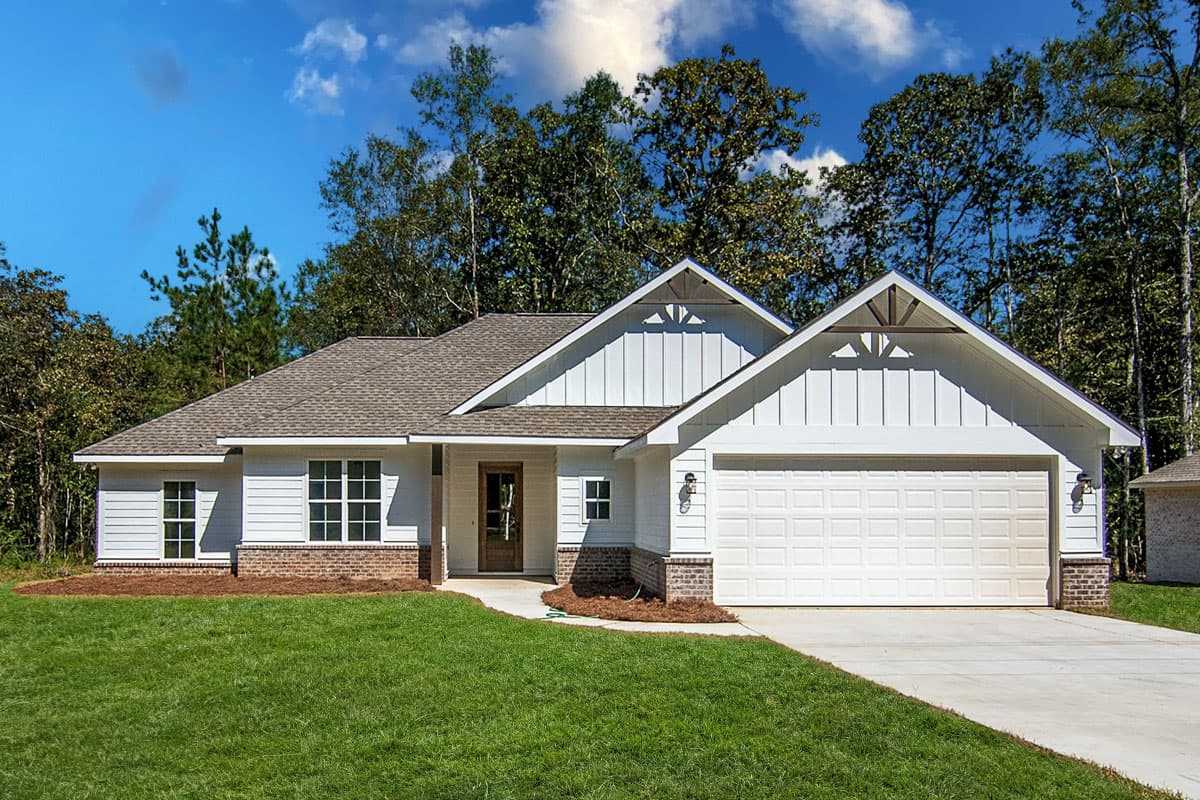 House plan exterior. One-story Modern Farmhouse with gables, board and batten siding, and an attached two-car garage. Brick accents at base.