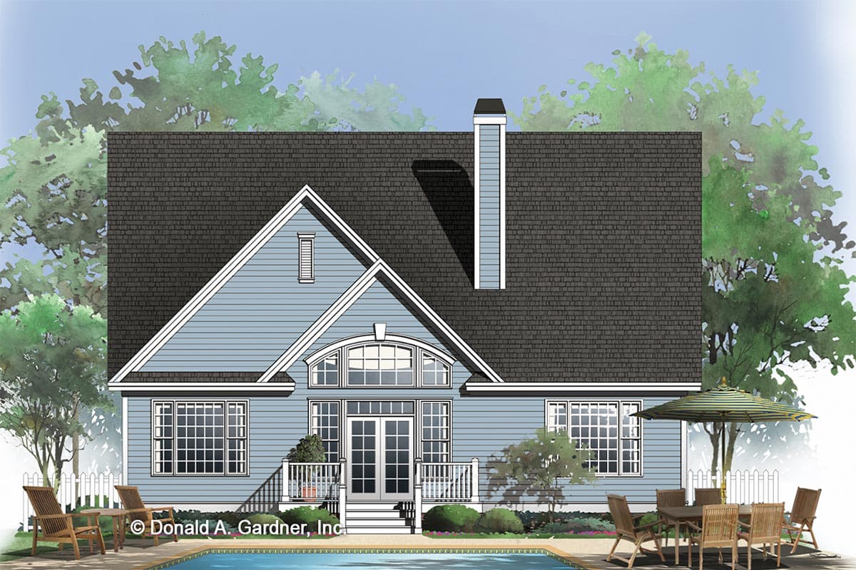 House plan exterior: Blue siding, dual gables, prominent chimney, arched central window, and double doors leading to deck.