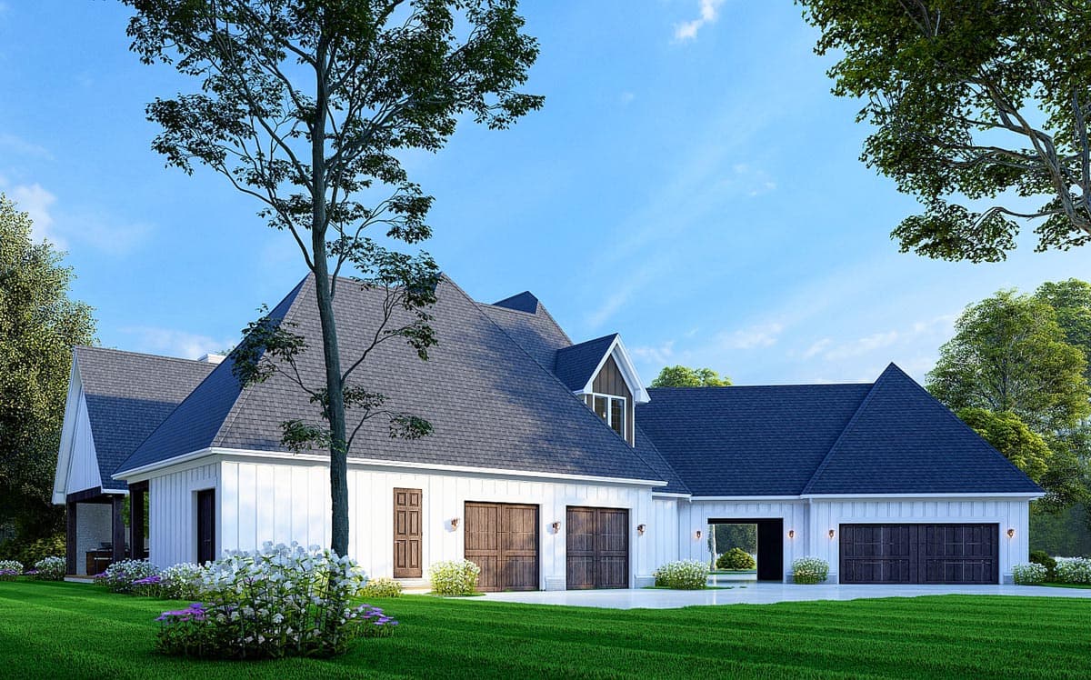 Modern Farmhouse house plan exterior with a large gable roof, white board and batten siding, and a five-car garage.