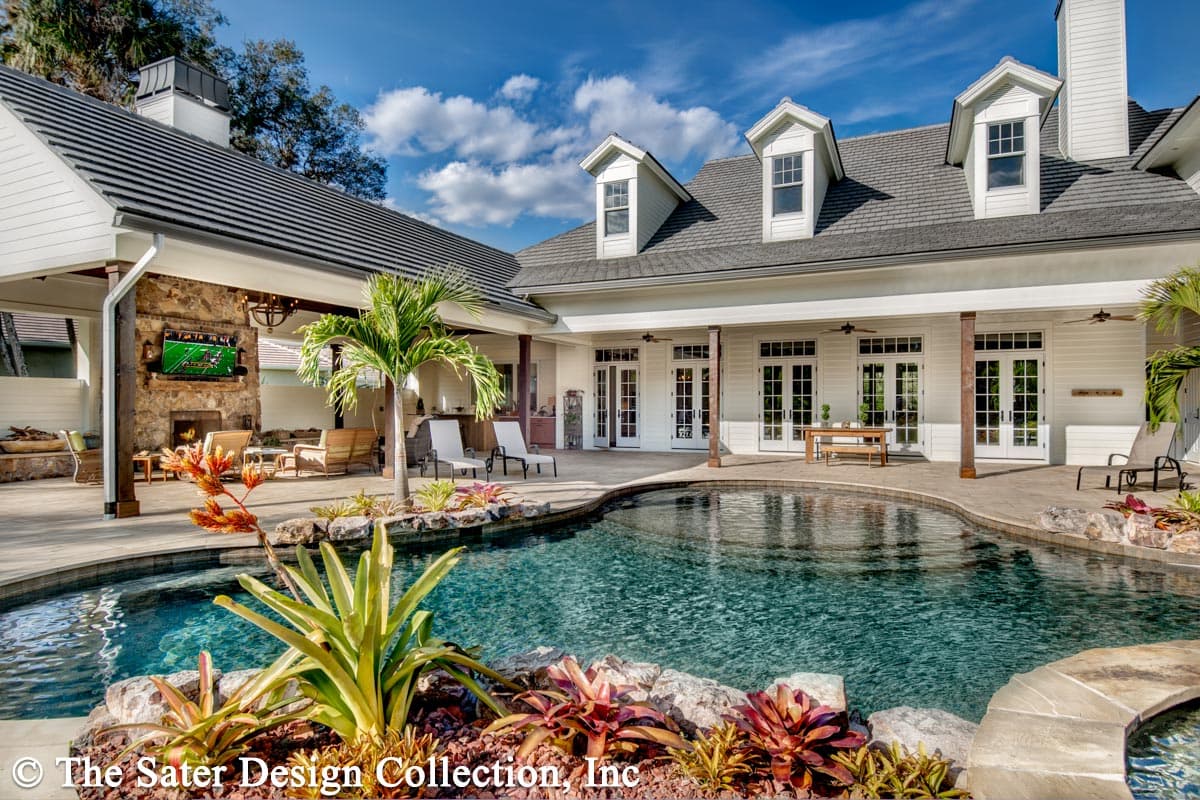 House plan exterior: Two-story Modern Farmhouse with gables, dormers, covered patio, and pool.