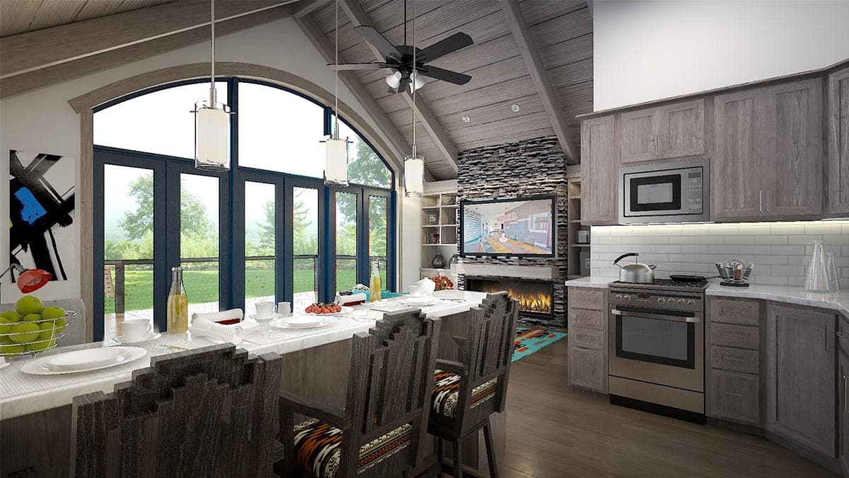 Great room with vaulted ceiling, stone fireplace, and kitchen island with bar seating.