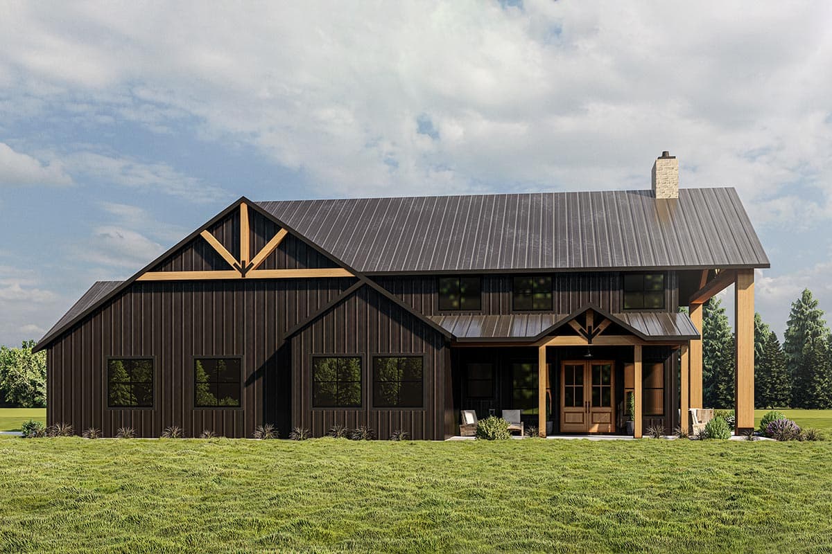Modern Farmhouse house plan exterior with dark vertical siding, metal roof, exposed timber beams, and stone chimney.