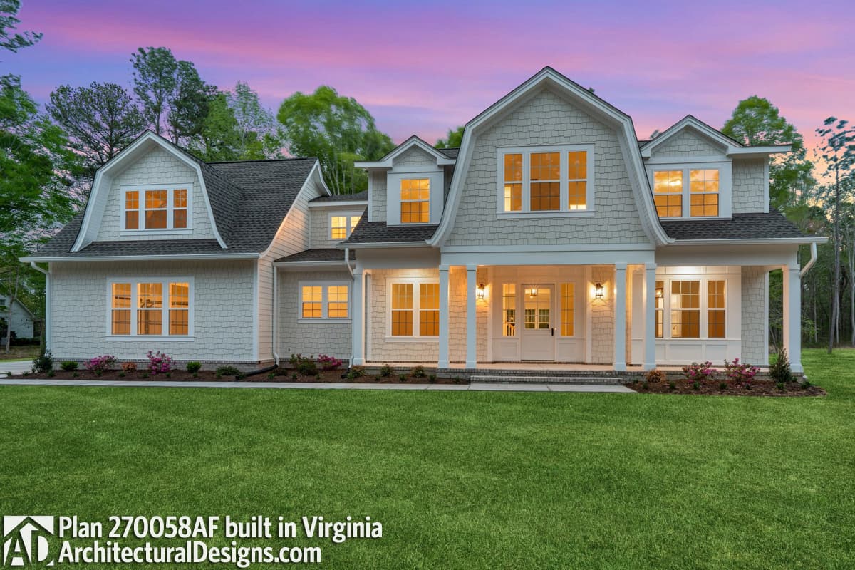 House plan exterior: Two-story Modern Farmhouse with gambrel dormers, a covered front porch, and wide gable rooflines.
