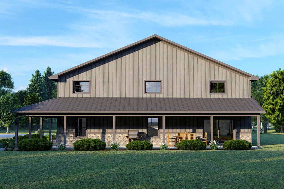 House plan exterior: Tall gabled building with a wrap-around porch, metal siding, stone accents, and three upper windows.