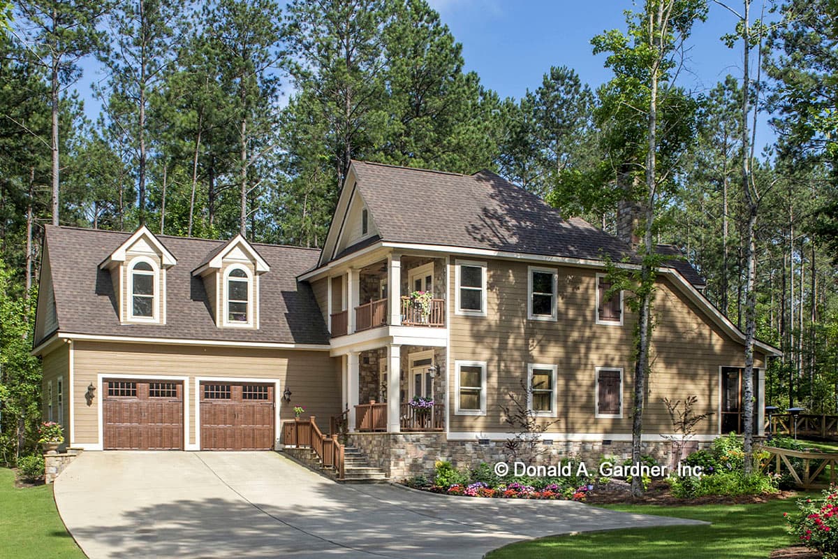 House plan exterior with a two-story design, dormer windows, and a two-car garage.