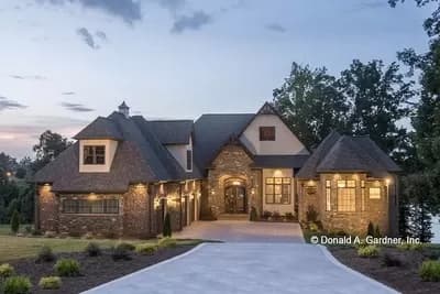 Tudor-influenced Walkout Basement Home Plan with Elevator