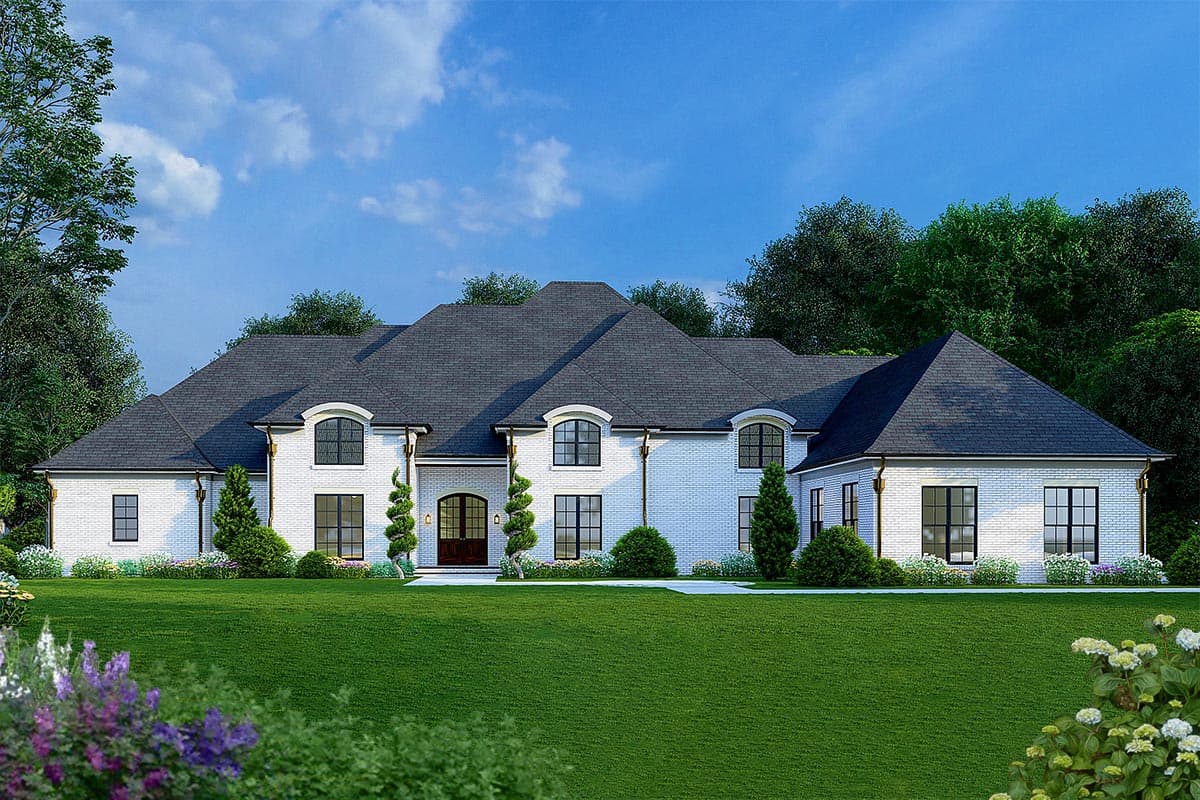 House plan exterior. Two-story, brick facade, arched window dormers, and multiple gable rooflines. Landscaped front yard with mature trees.