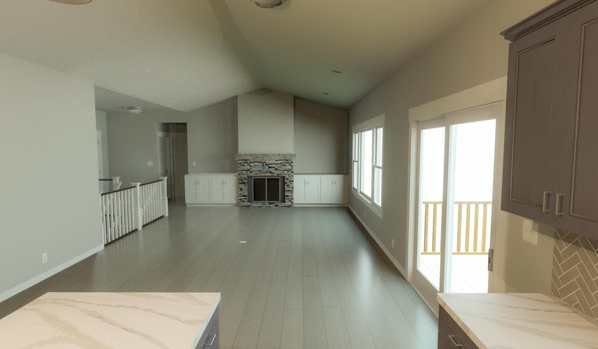 Interior view of a great room with vaulted ceiling, stone fireplace, built-in cabinets, and sliding glass doors to a deck.