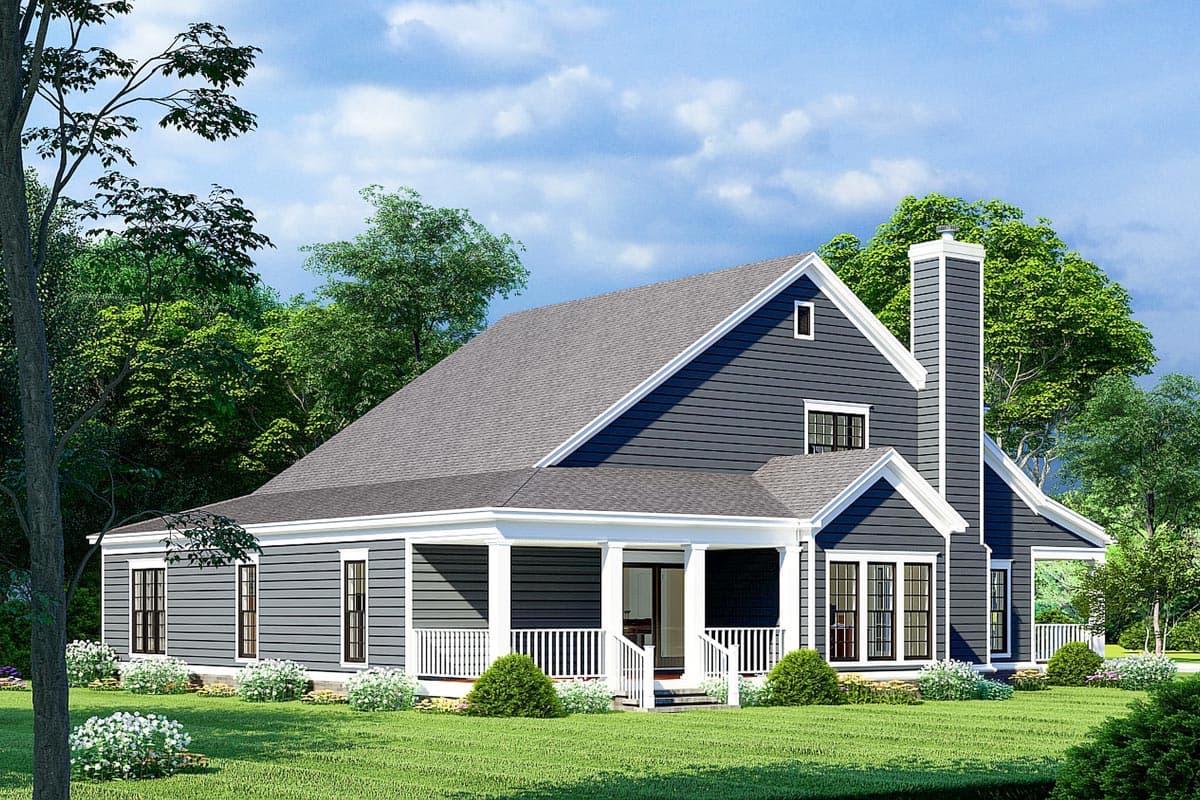 House plan exterior: Traditional two-story home with wraparound porch, prominent gables, and a large stone chimney.