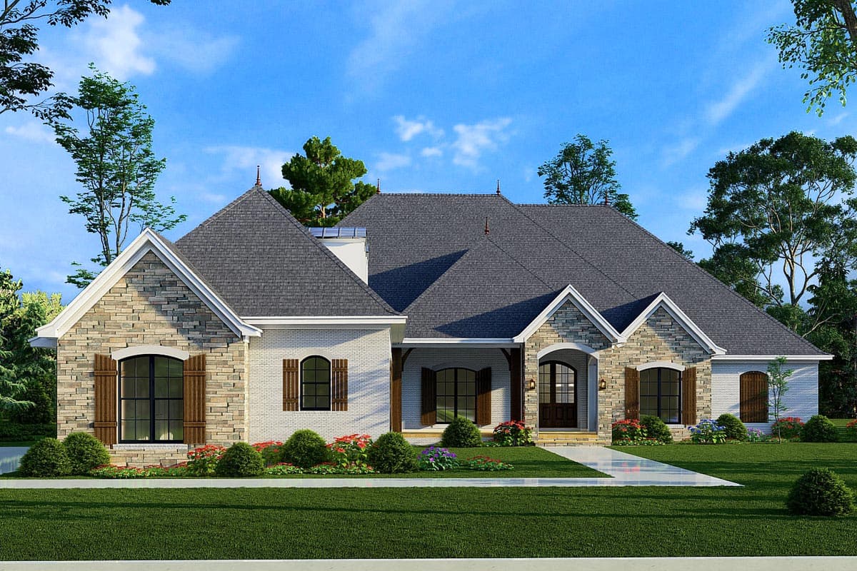 House plan exterior. A one-story house with stone and brick facade, gabled roof, arched entry, and shuttered windows.