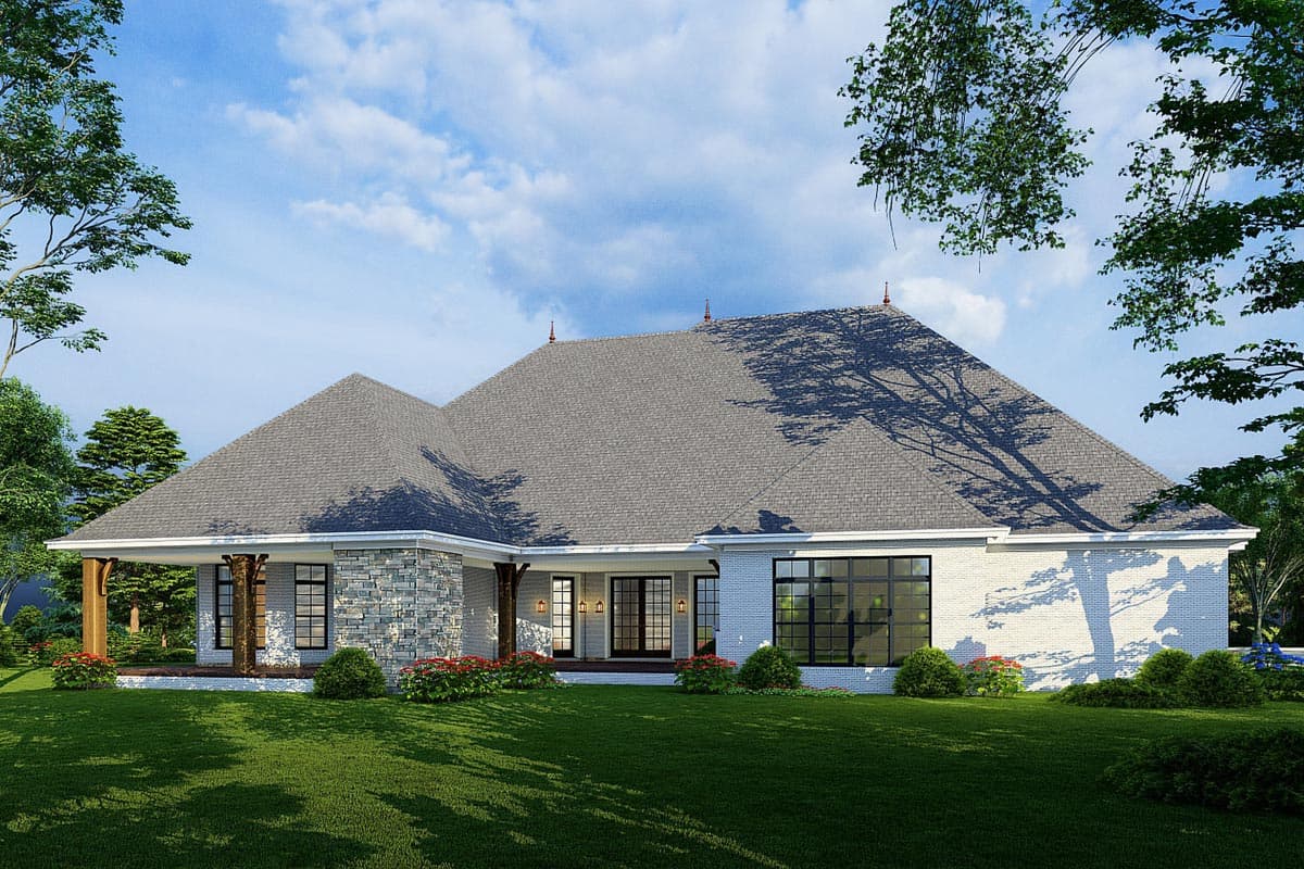 House plan exterior: Ranch style, single story with covered porch, stone accent walls, and large windows.