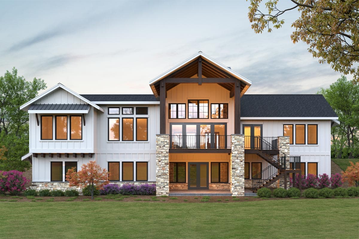 Modern house plan exterior with board and batten siding, stone accents, gables, and a central two-story window facade.