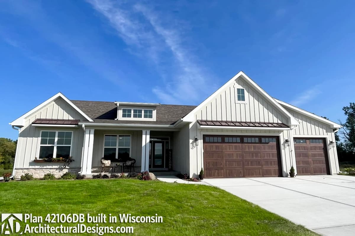 Modern Farmhouse house plan exterior with gabled dormers, covered entry porch, and a three-car garage.