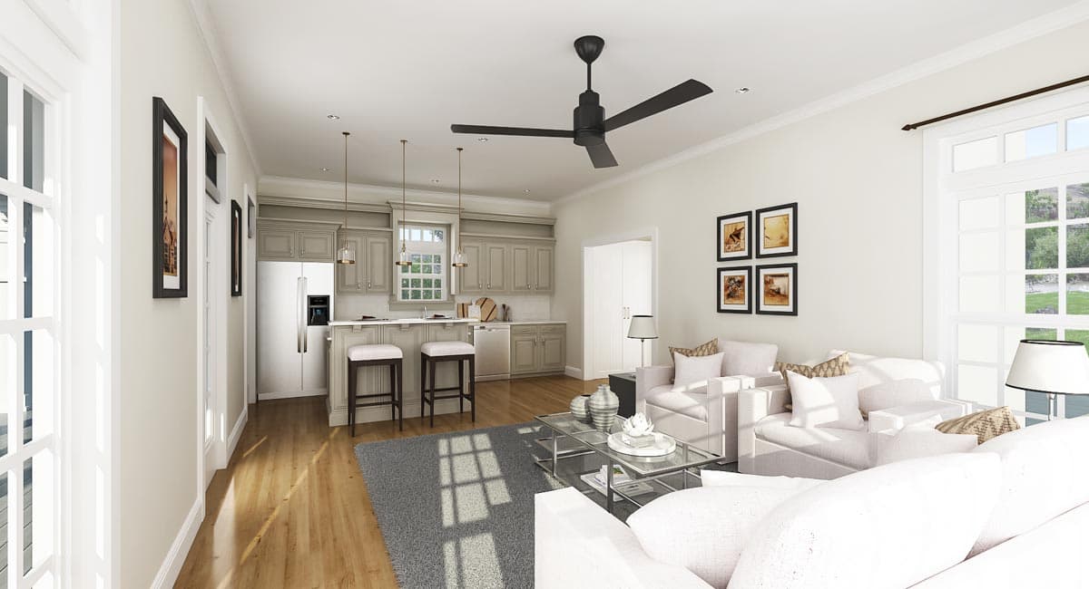 Open concept living area and kitchen with island seating, light gray cabinetry, stainless steel appliances, and large windows.