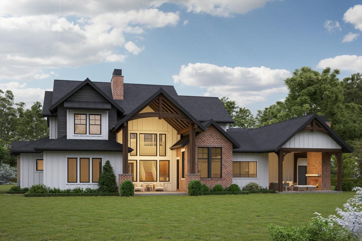 Modern Farmhouse house plan exterior with dark gables, white board-and-batten siding, brick accents, and covered porch.
