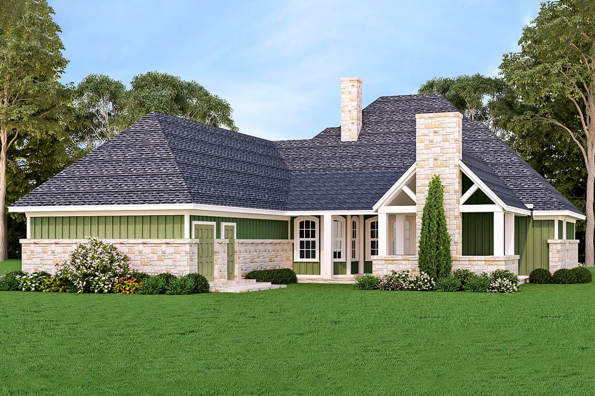 House plan exterior with stone and green siding, a prominent stone chimney, gables, and arched windows.