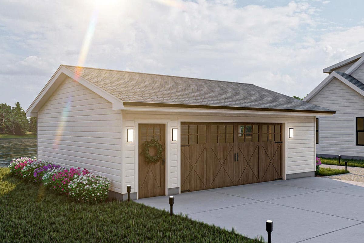 House plan exterior: Gable roof, white siding, two-car garage doors with wood grain finish, and a single entry door.