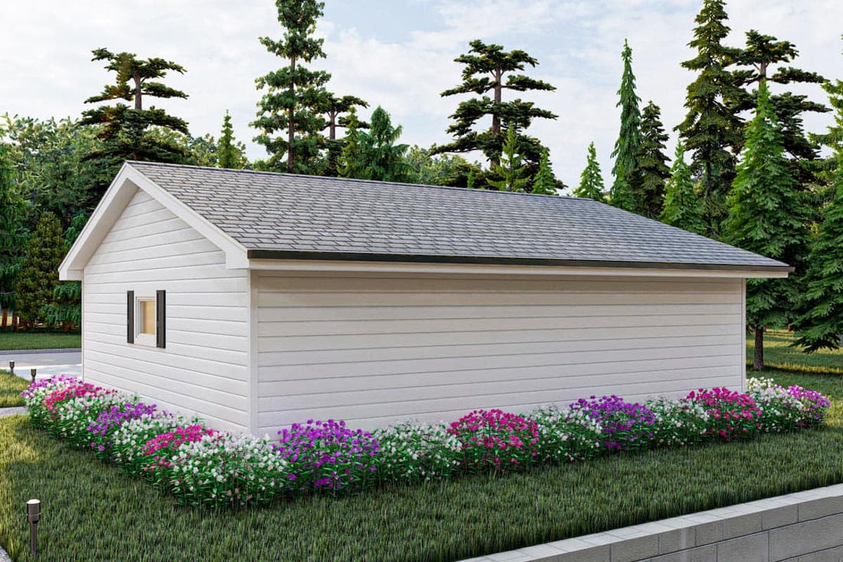 House plan exterior: simple gable roof, horizontal siding, single window with shutters, surrounded by trees and flowers.