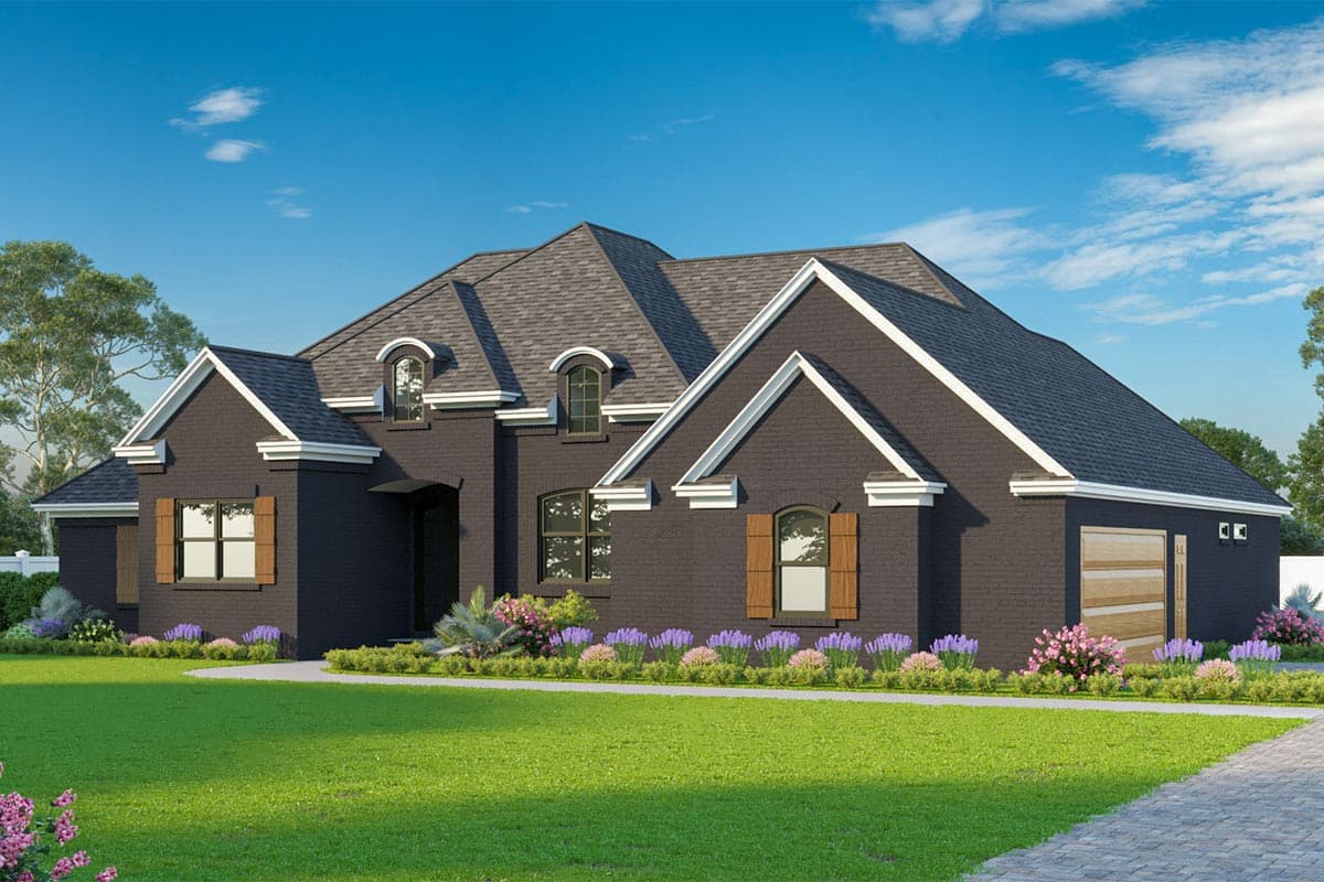House plan exterior: One-story brick home with multiple gables, arched dormers, and a detached garage.