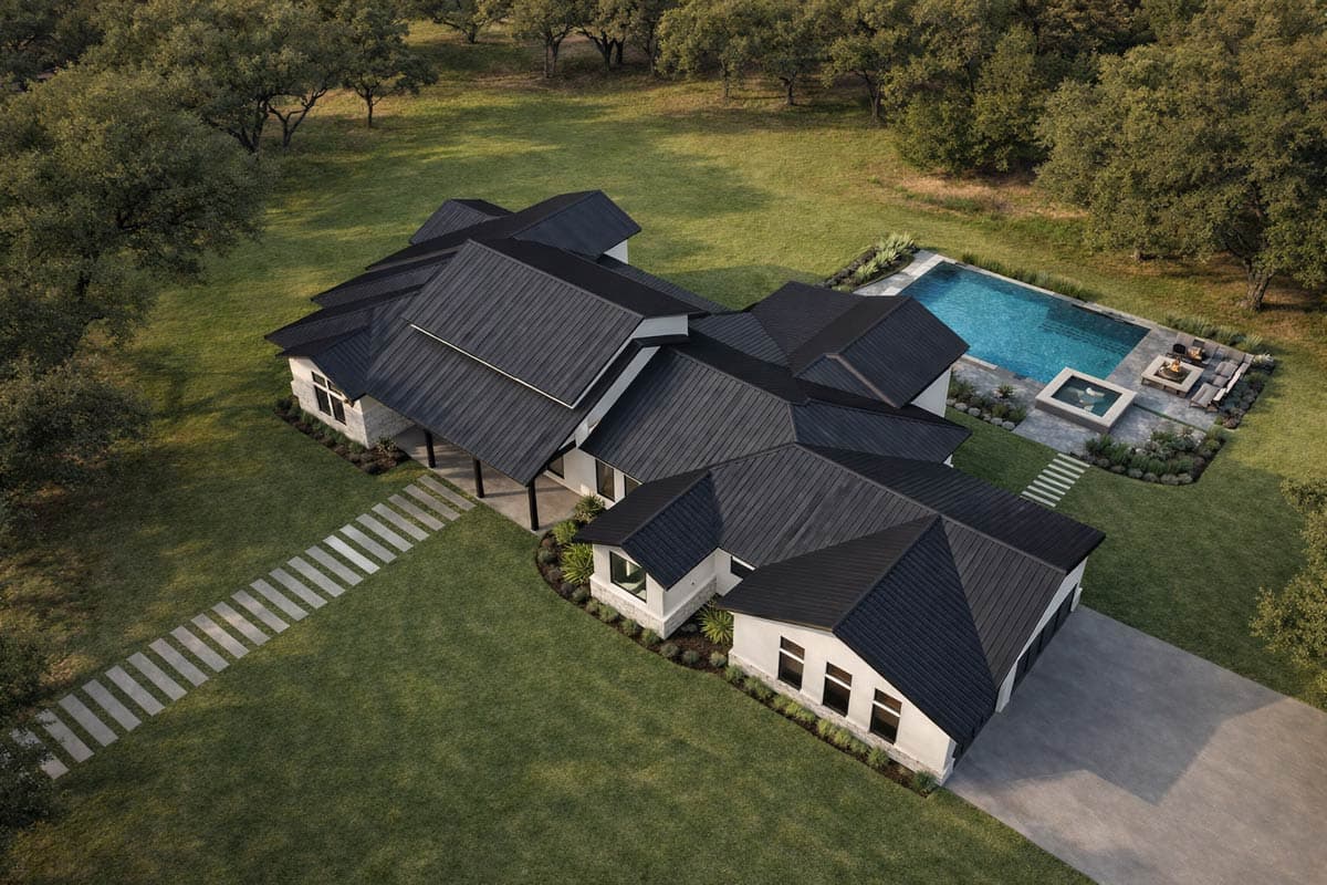 House plan exterior: Modern Ranch style, one story, with intersecting gables, covered porch, and attached garage.