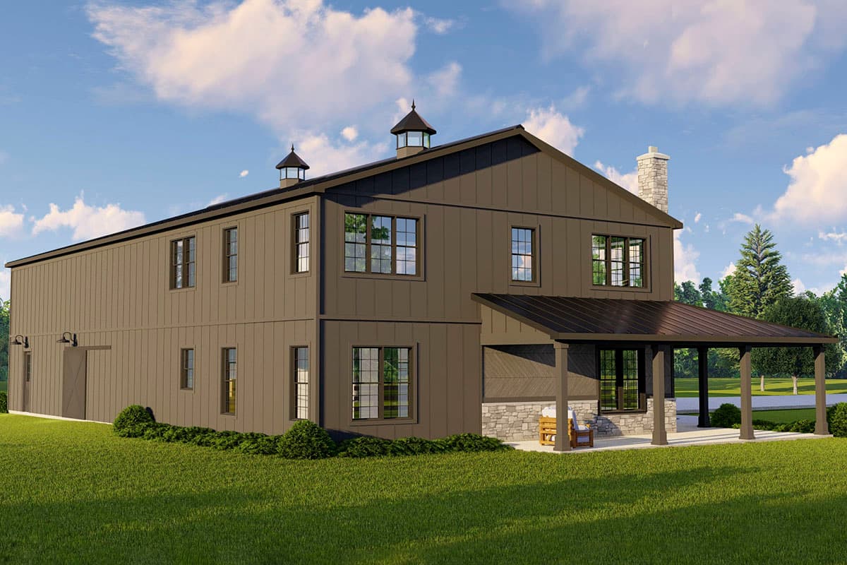 Two-story Modern Farmhouse exterior with board and batten siding, prominent cupolas, covered porch, and stone foundation.