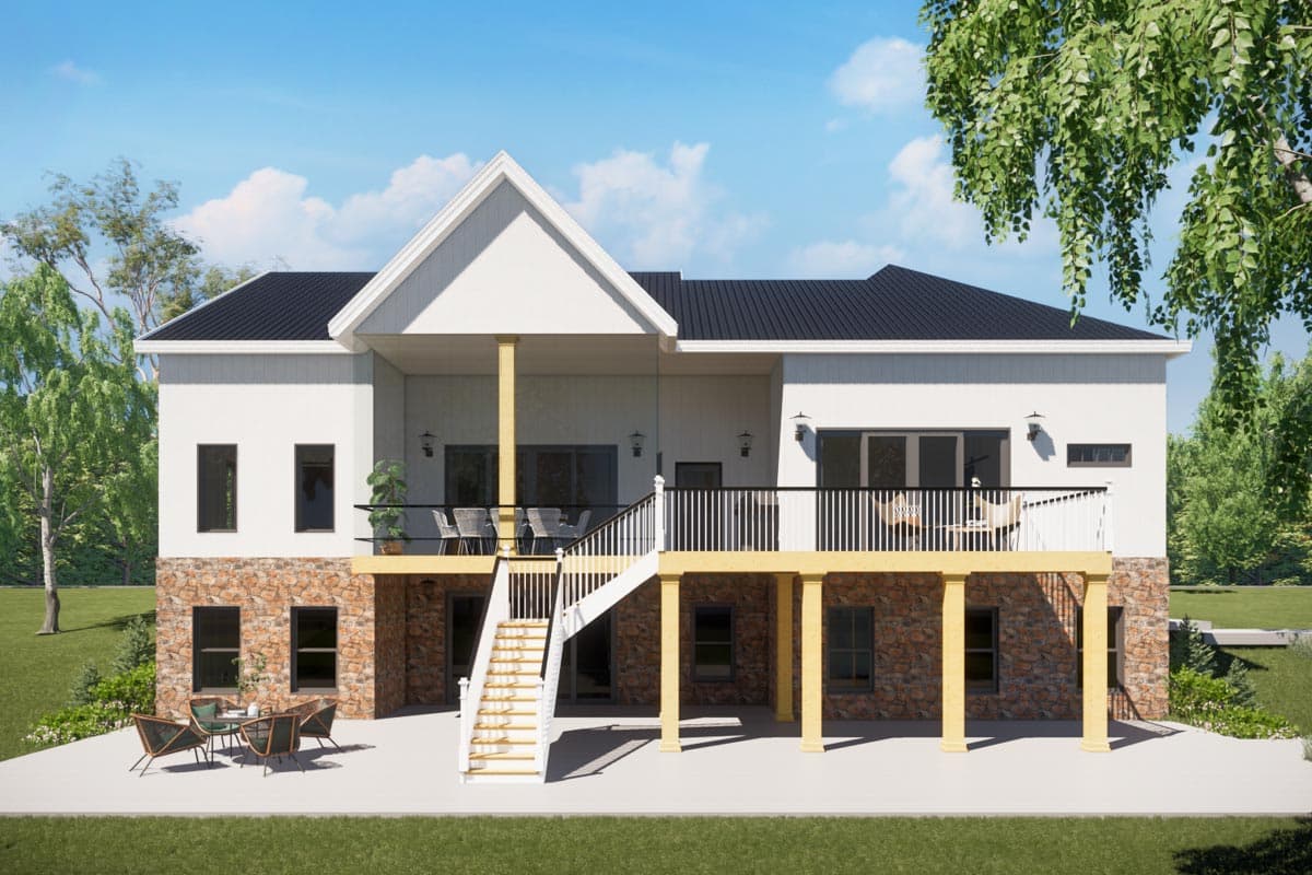 House plan exterior: two-story modern design with stone base, prominent gables, upper-level deck, and central staircase.